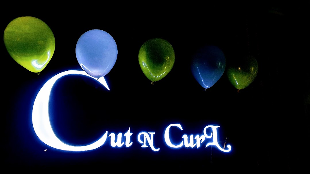 Cut N Curl Unisex Salon - Logo