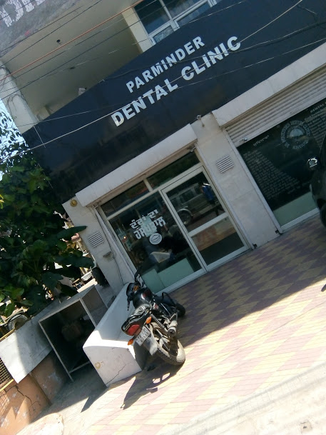 Parminder Dental Clinic Logo